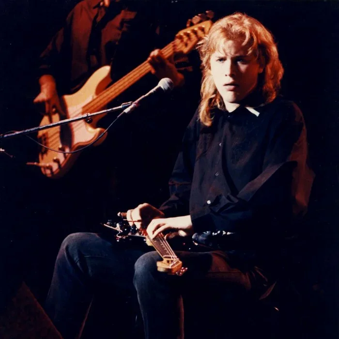 Jeff Healey playing guitar flat on his lap